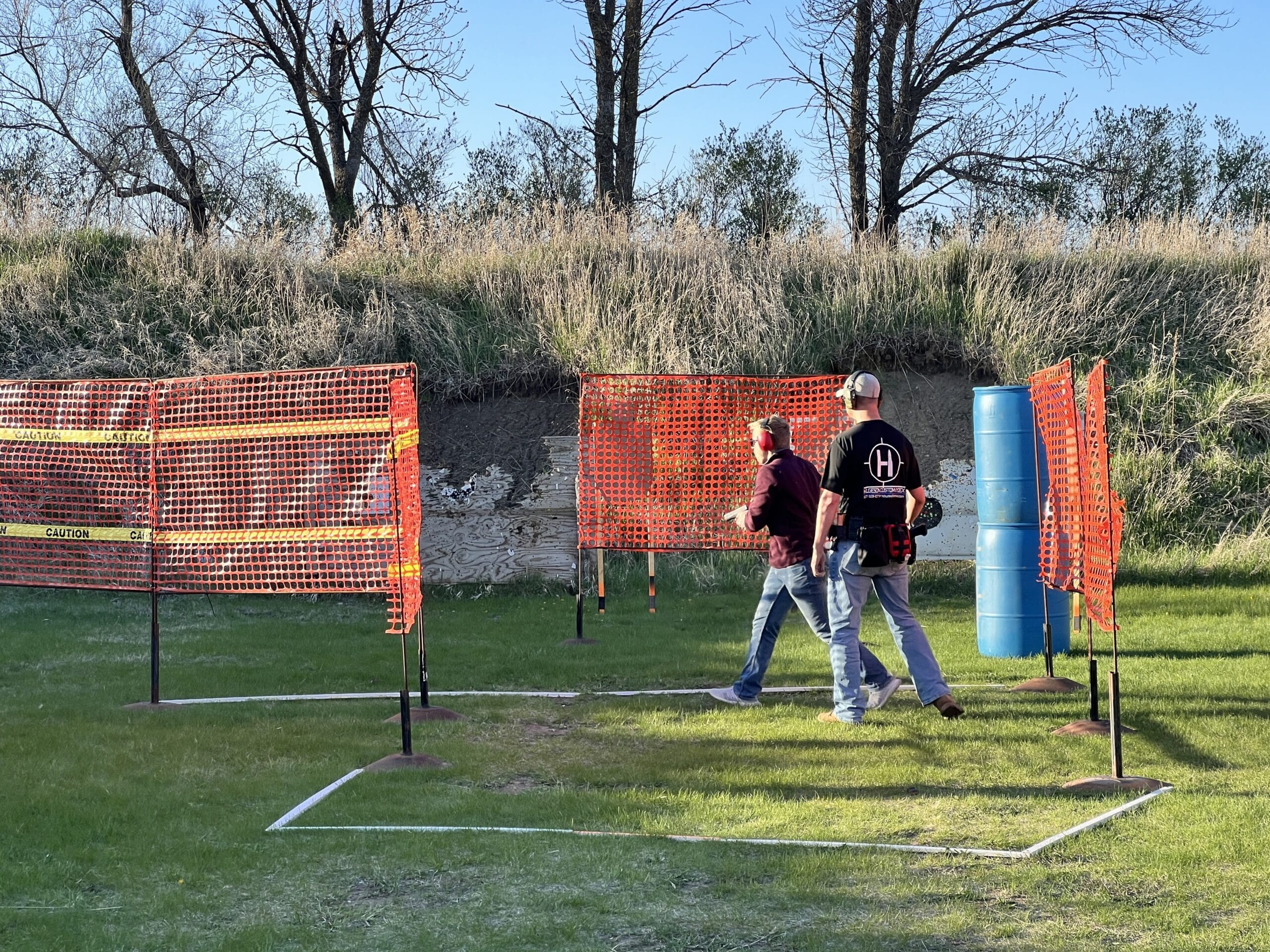 two shooters at the defensive pistol range