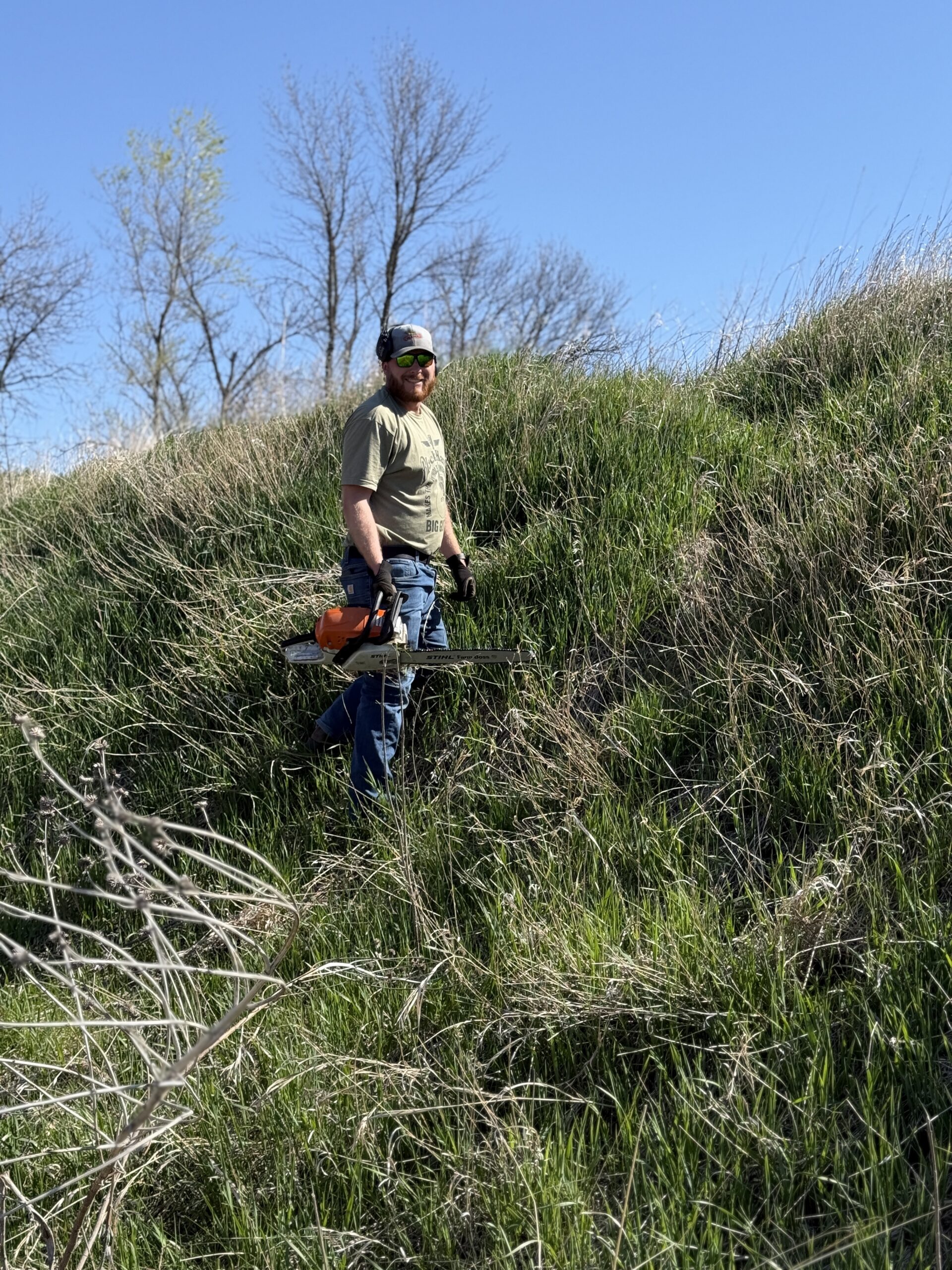 Volunteer Trimming Brush & Trees at Range Clean Up Day 2026