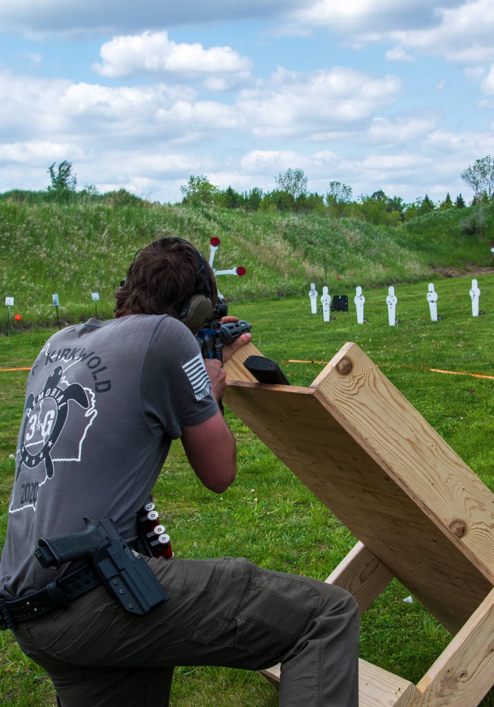 man shooting targets using a stand